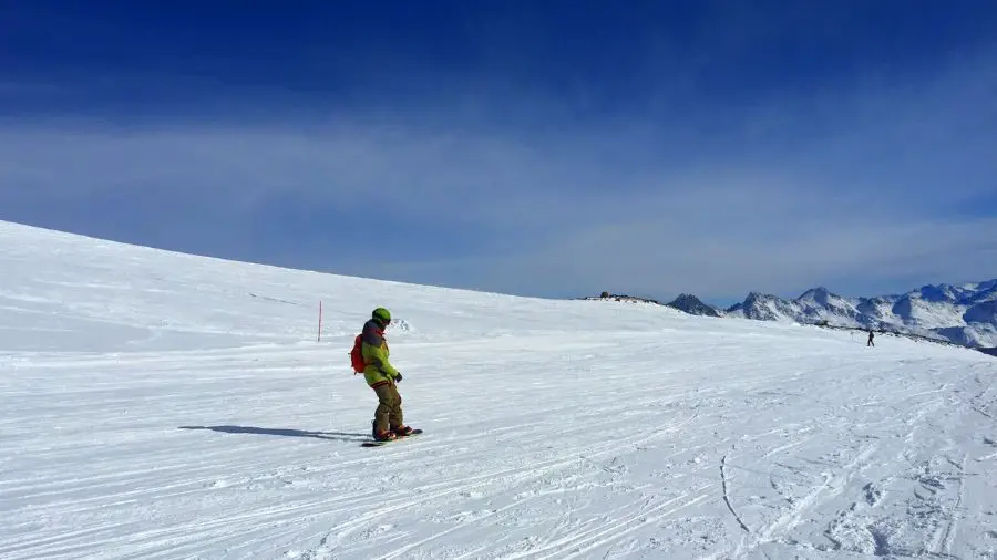 Man snowboarding down a hill